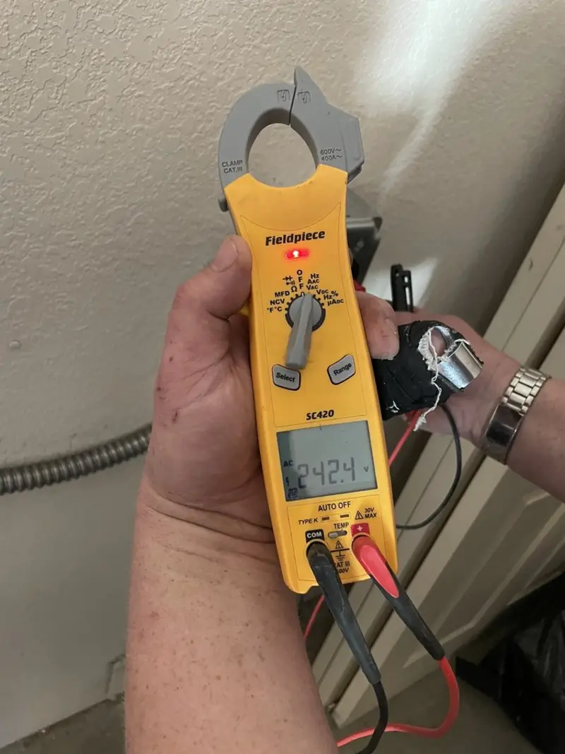 Voltage testing with clamp meter during Outlet Installation in Twin Lakes